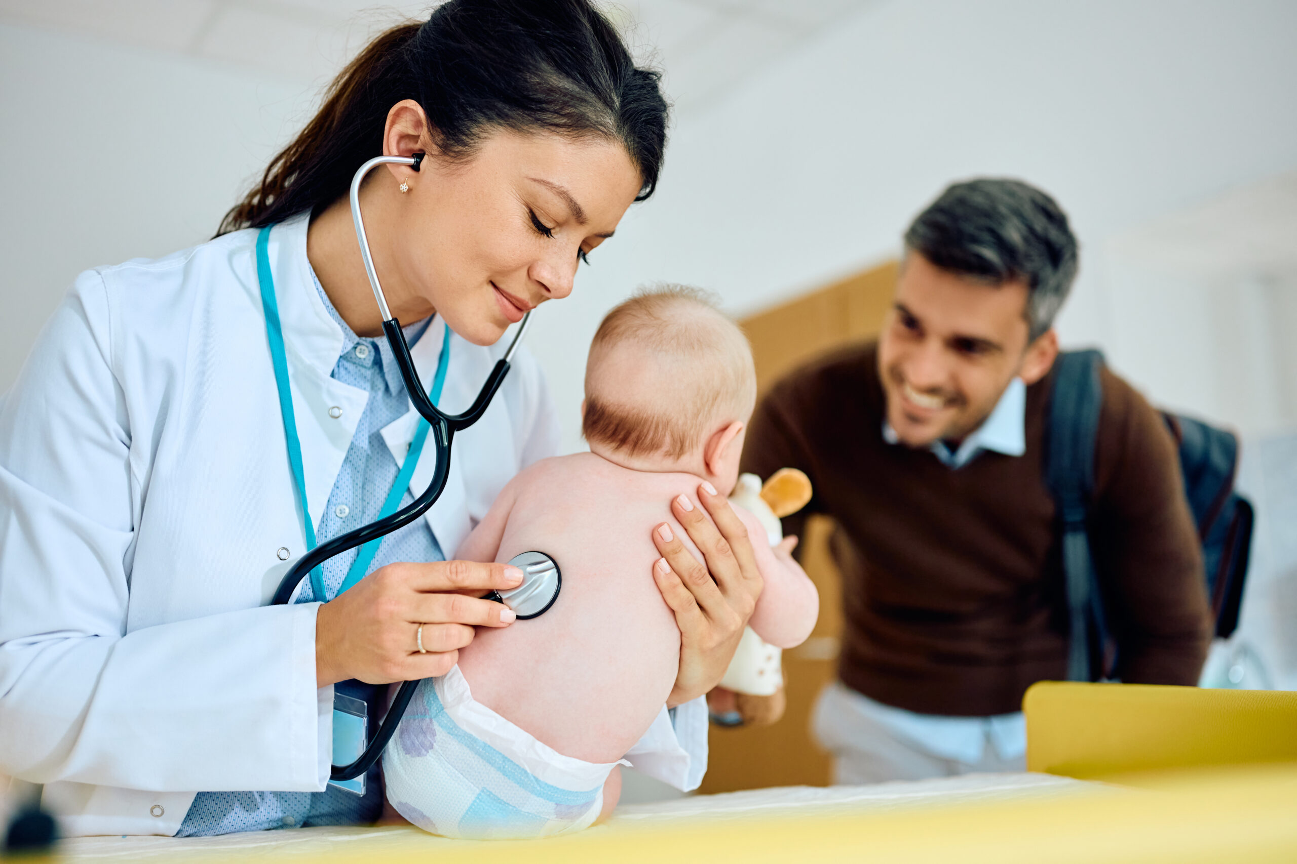 female-pediatrician-and-baby-during-medical-examin-2023-06-07-18-00-28-utc-scaled-
